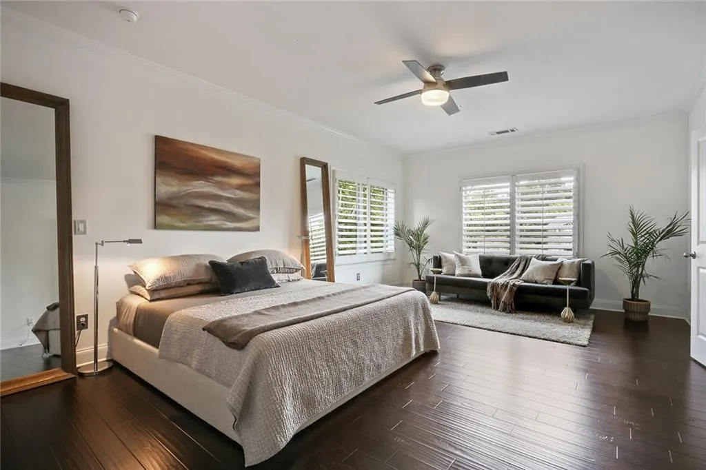 Oversized primary bedroom with seating area.