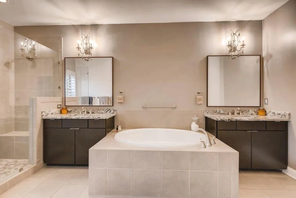 Two vanities and tub.