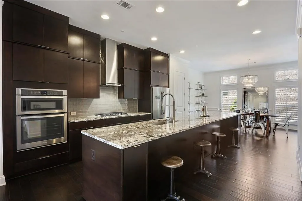 Chef's kitchen with large  granite island.