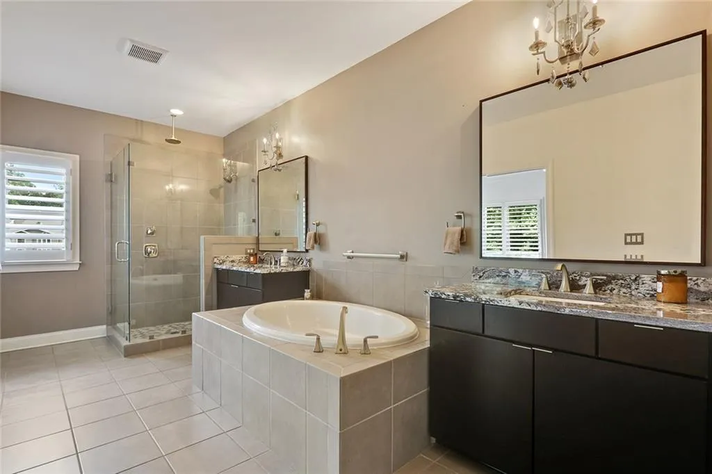 Primary Bath with two vanities, tub & shower.