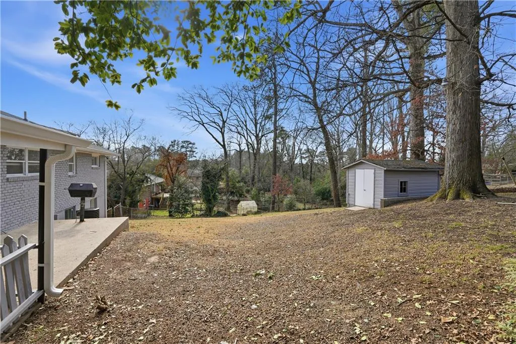 View of yard featuring a storage shed