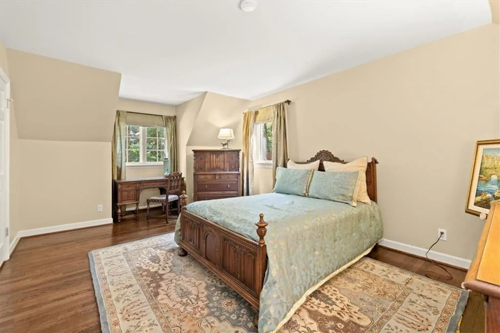 Bedroom with hardwood / wood-style flooring