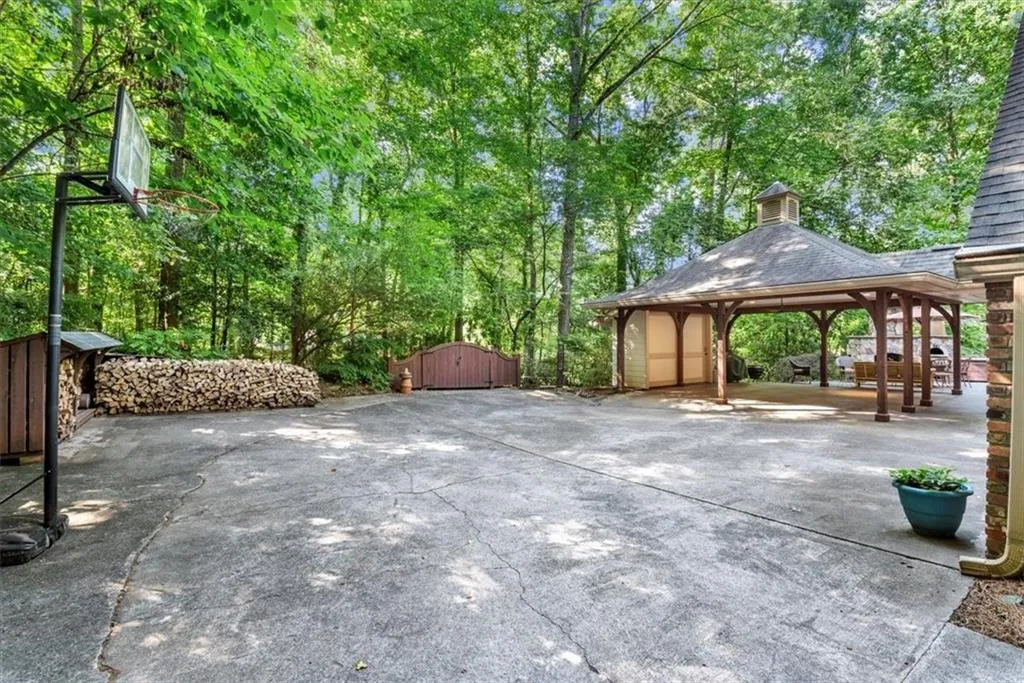 View of patio / terrace featuring a gazebo and a storage unit