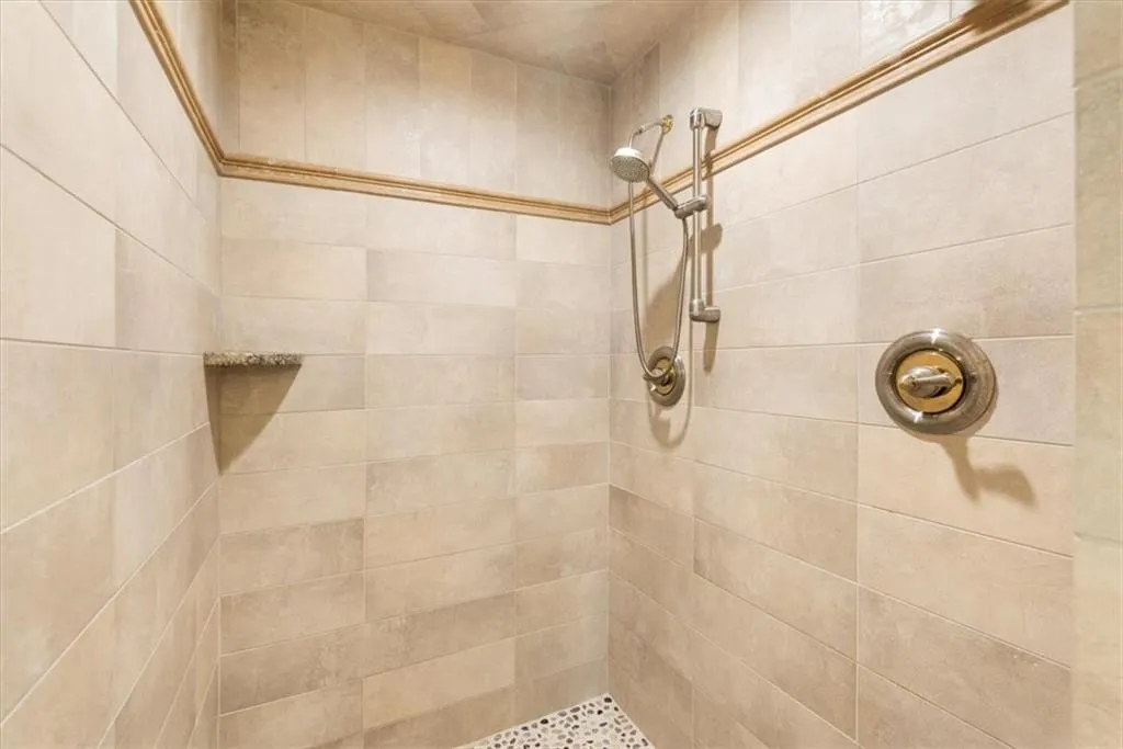 Bathroom with tiled shower