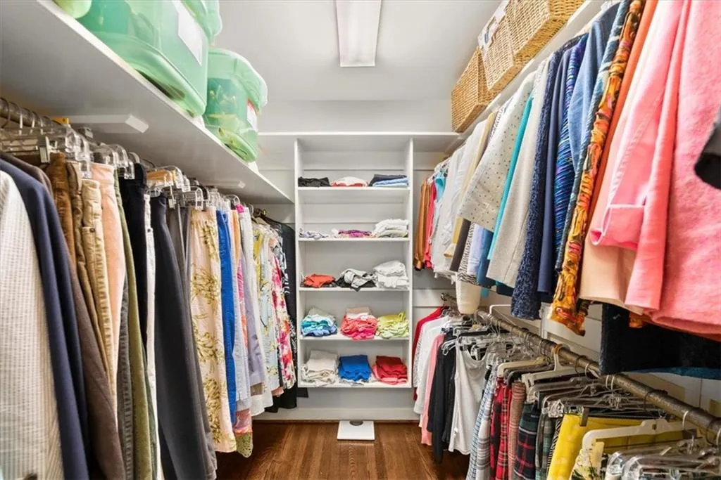 Walk in closet featuring wood-type flooring