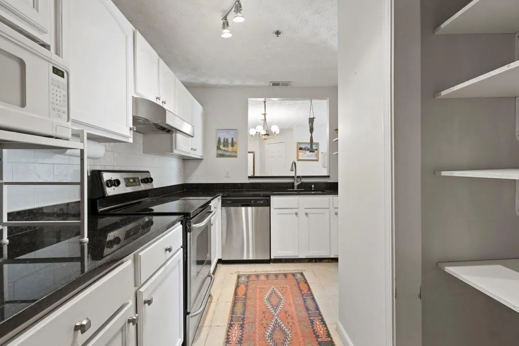 Kitchen with stainless steel appliances, a sink, a