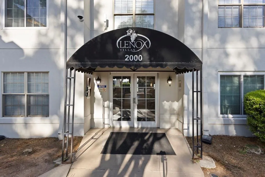 View of exterior entry with french doors and stucc