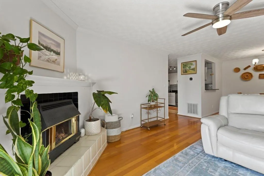 Living room featuring wood finished floors, visibl