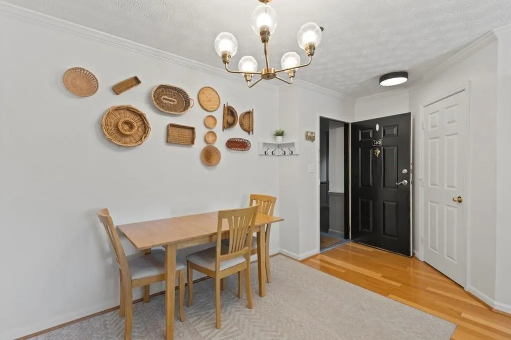 Dining space with baseboards, wood finished floors