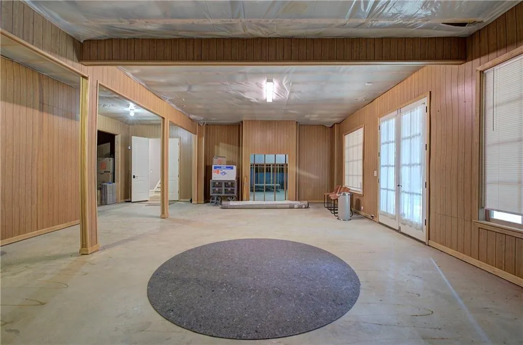 Below grade area featuring wooden walls