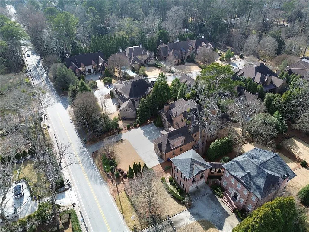 Aerial view of property's location featuring nearby suburban area