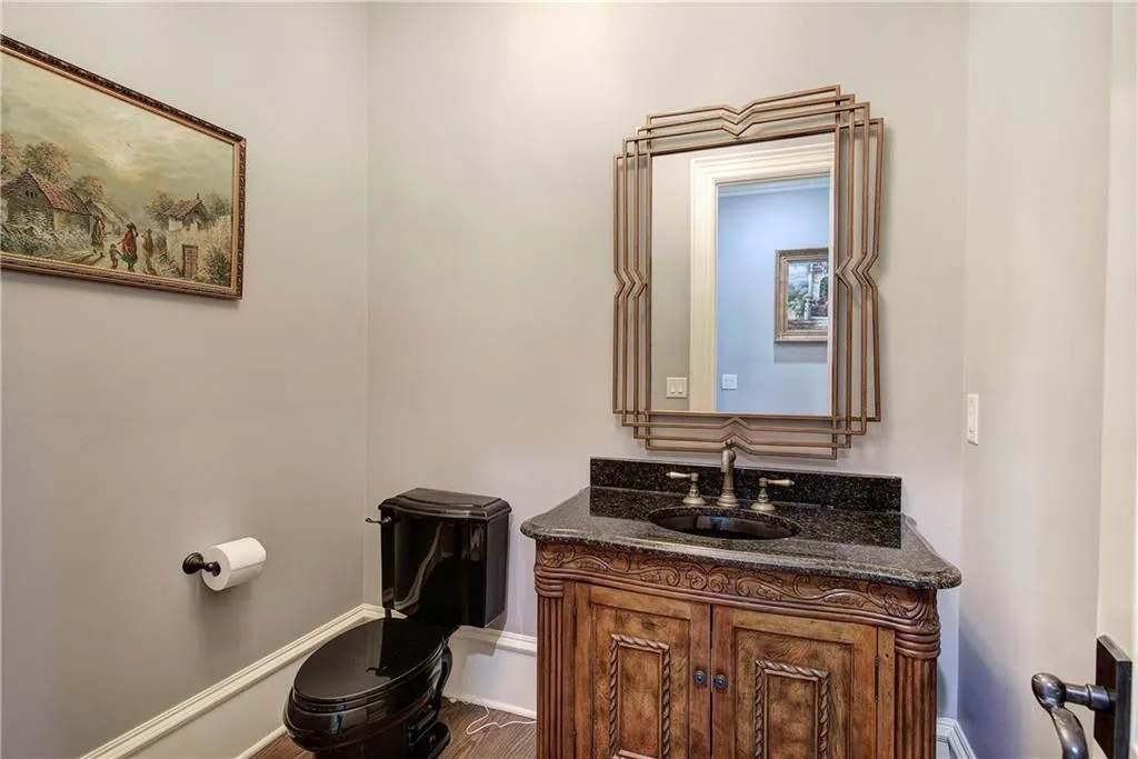 Bathroom featuring vanity and toilet