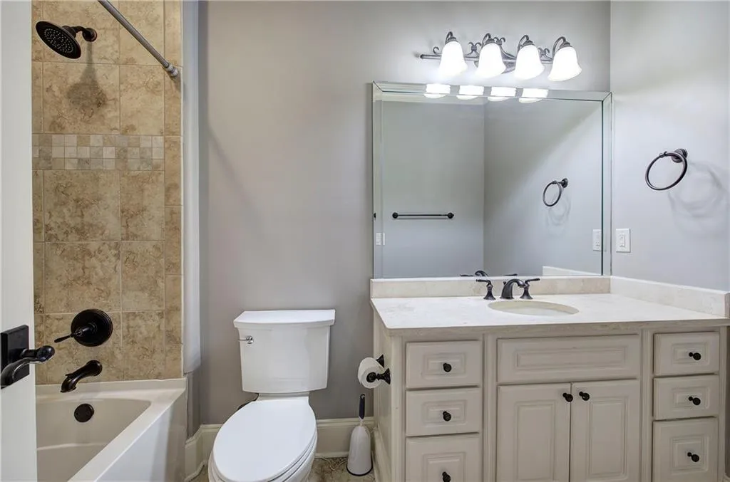 Full bathroom with vanity and bathtub / shower combination