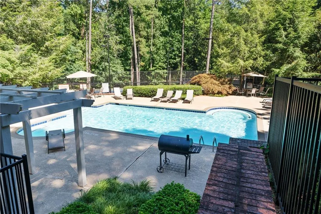 View of swimming pool with a patio area