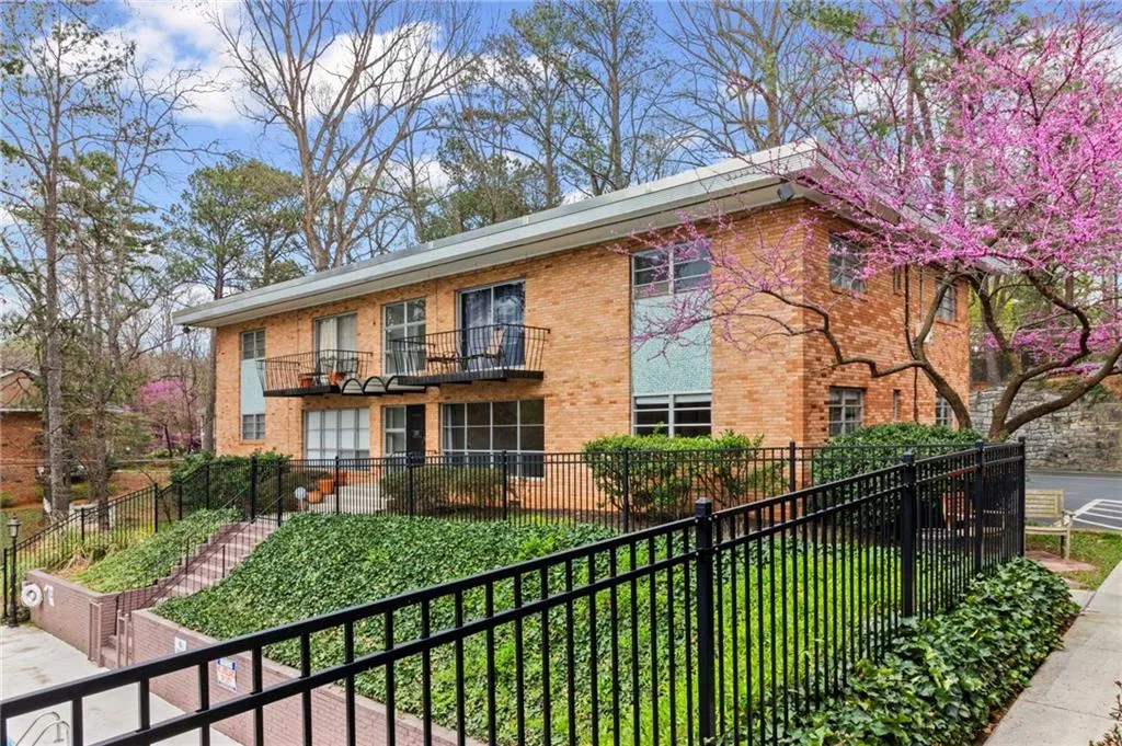 View of property featuring a fenced front yard