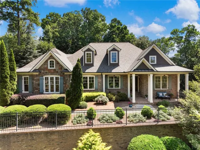 Stone and brick exterior with a covered porch