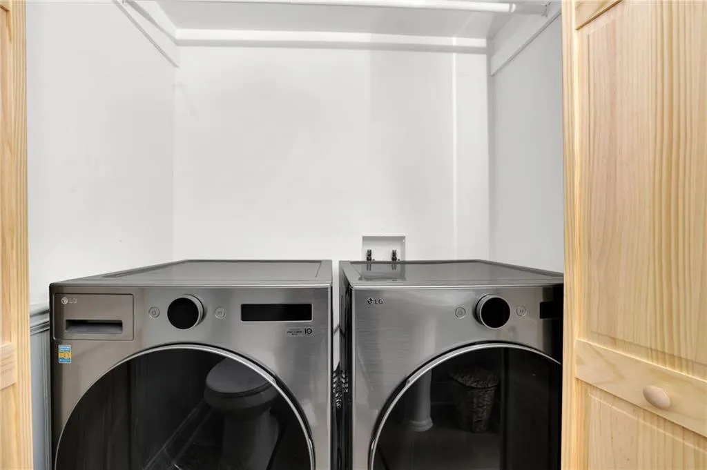 Washroom featuring washing machine and clothes dryer