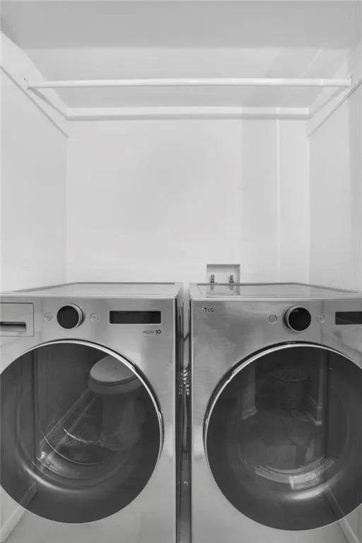 Laundry area with washing machine and clothes dryer