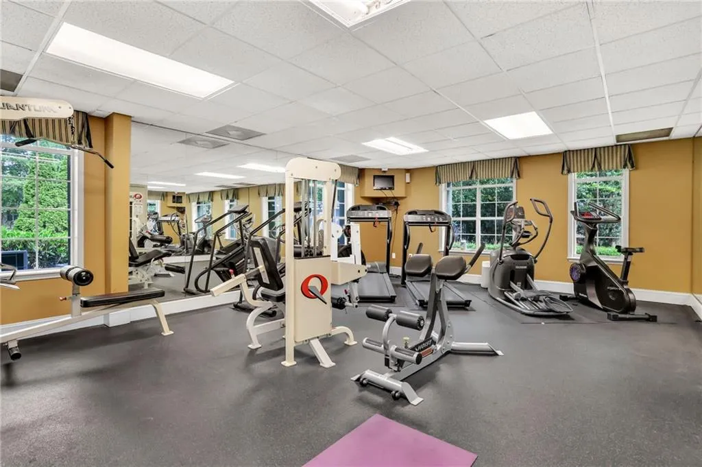 Exercise room featuring a drop ceiling