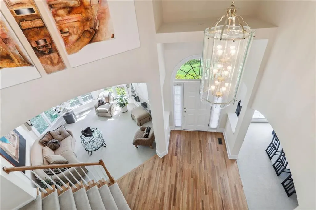 795 Spalding Heights Drive~ Admire the view from the upstairs landing of the lofty Entrance Way and Living Room.