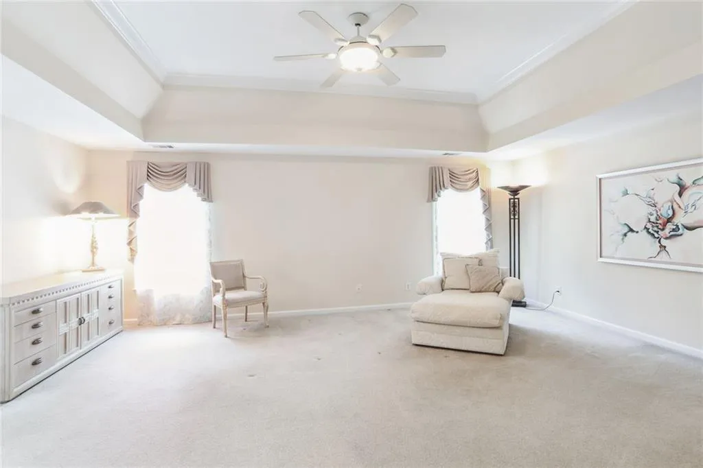 795 Spalding Heights Drive~ Spacious Primary Bedroom on the Upper level. This room can easily accommodate a large King size bed, dresser, night tables and a sitting area. Admire the view down below of the lush and private backyard.