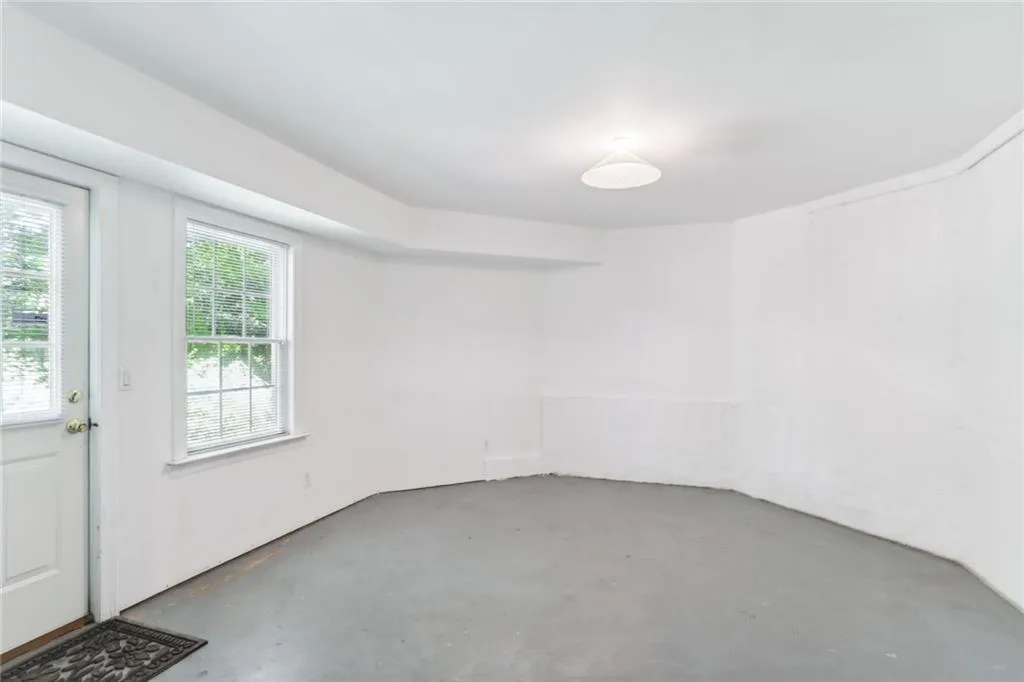 795 Spalding Heights Drive~ This used to be the owner's workshop but could be finished out into a lovely nanny suite. The full bathroom is already finished and conveniently located steps away from this room.