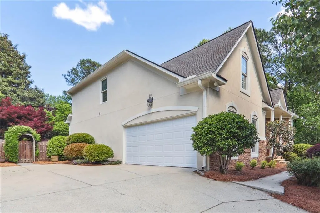 795 Spalding Heights Drive~ A side view of the 2 car garage. Not pictured is the abundant storage closet in the garage which safely stores out of season cushions for deck furniture as well as tools and garbage bins.