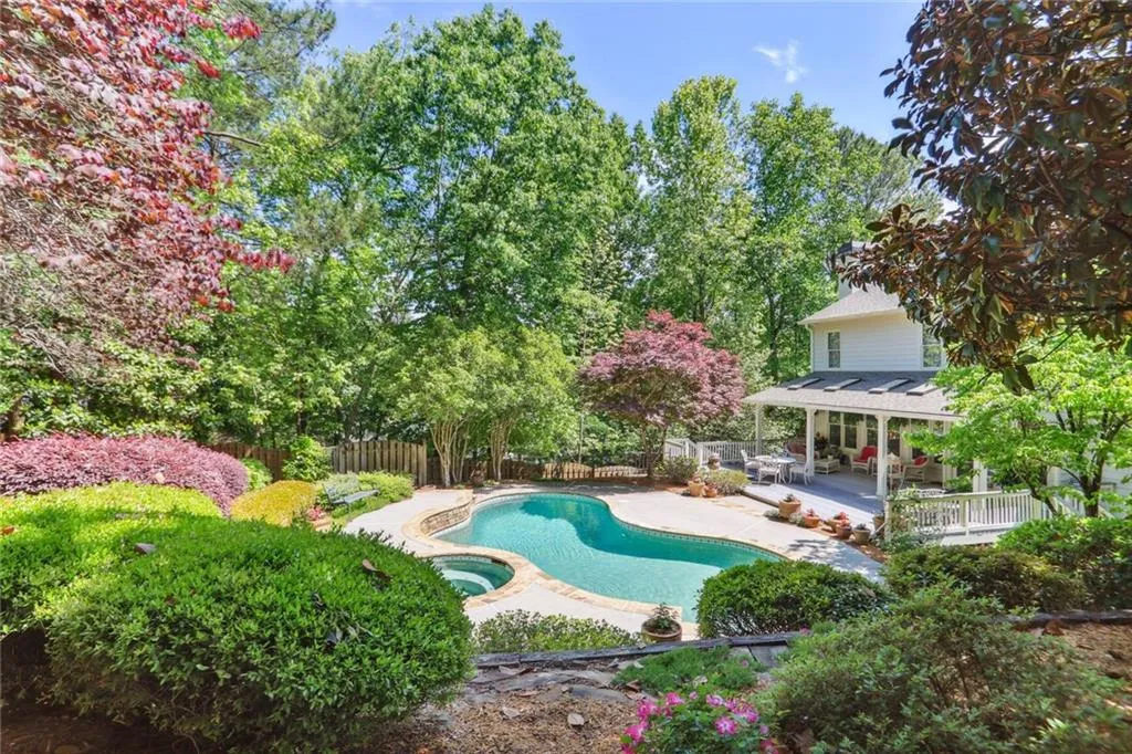 795 Spalding Heights Drive~This picture is taken from the higher tier where there is a firepit and stone patio. Not pictured is a large table and chairs- perfect for dining al fresco.