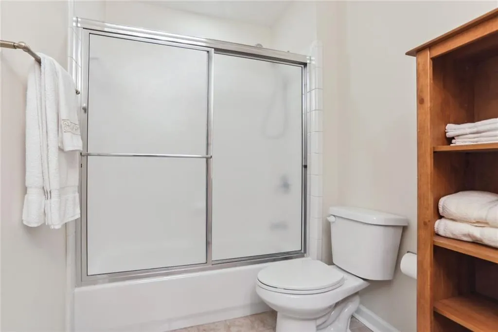 795 Spalding Heights Drive~ One of two secondary bathrooms, this bathroom features a tub/shower combination and single vanity. There is plenty of room for a etagere cabinet- perfect for linen storage.