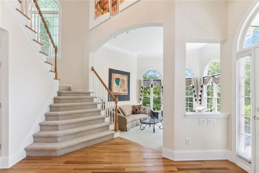 795 Spalding Heights Drive~ The turreted Living Room tucked to the right upon entry offers an elegant touch and entertaining with ease.