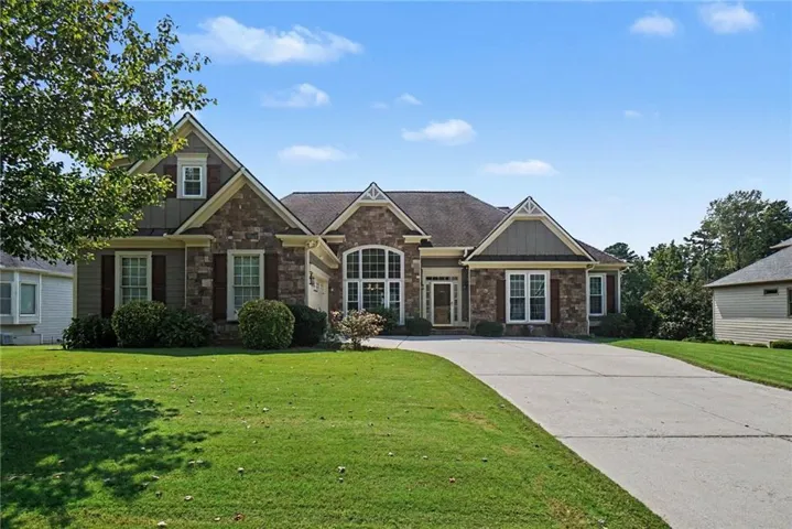 Stone and siding exterior with gabled roof lines