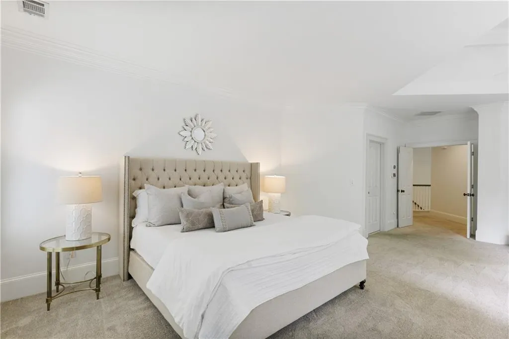 Primary bedroom has an oversized custom closet and leads to the laundry room.