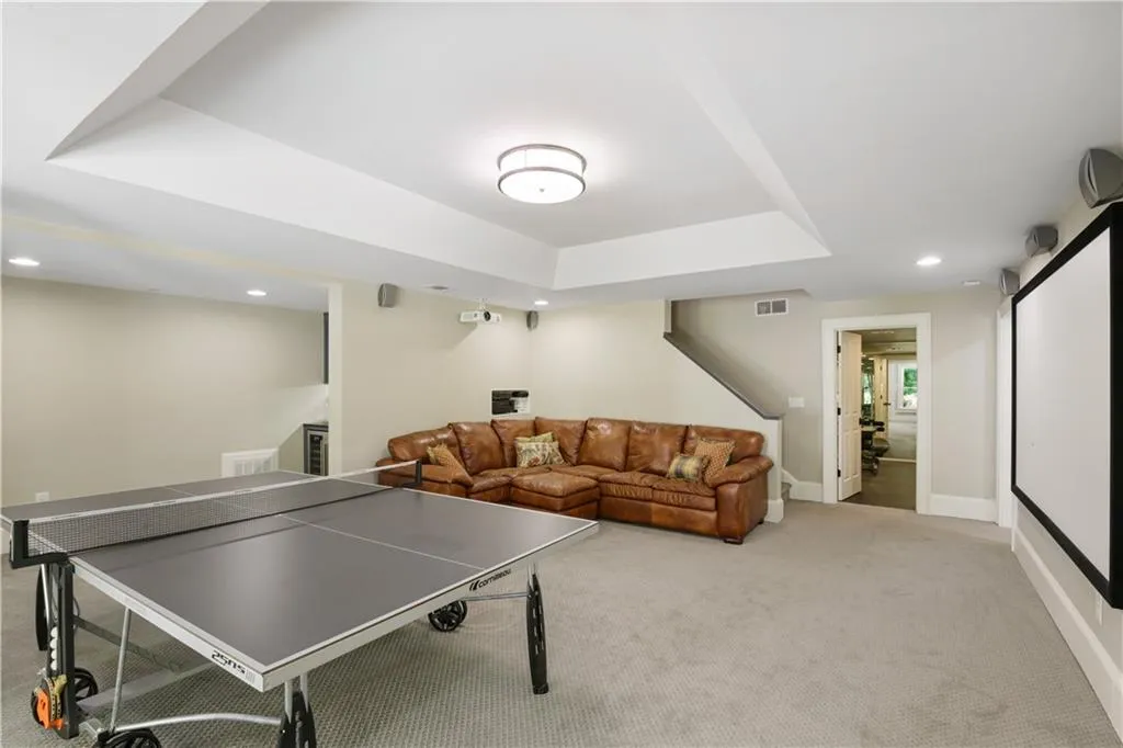 Terrace level with french doors that lead to a covered porch and the pool.