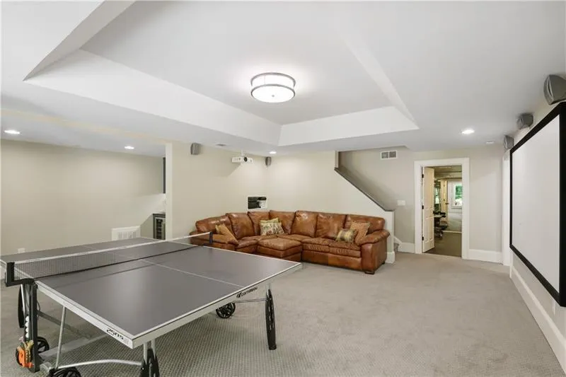 Terrace level with french doors that lead to a covered porch and the pool.