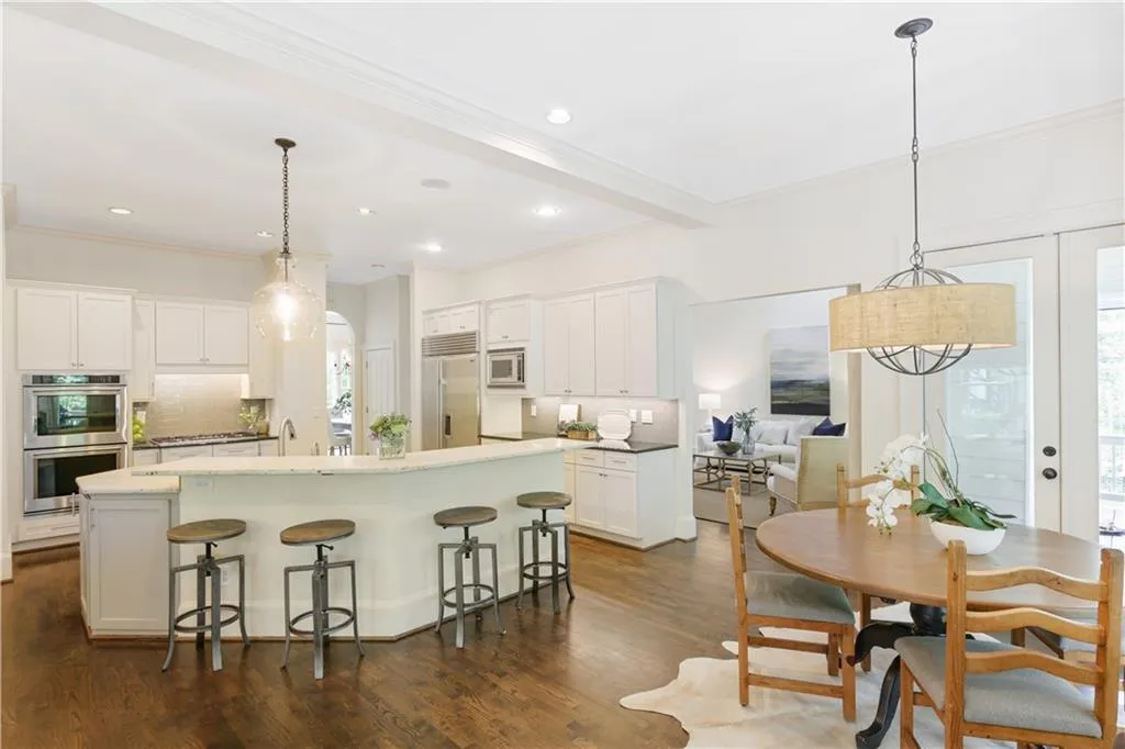 Renovated kitchen with stainless appliances.