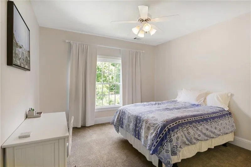 1 of 3 secondary bedroom with a jack and jill bath and separate vanities.