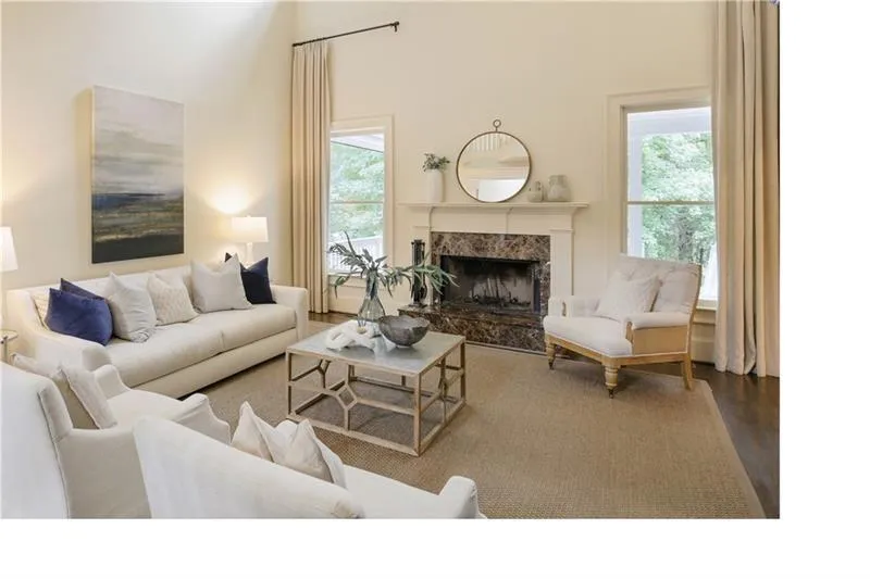 Oversized family room with fireplace adjacent to the kitchen.