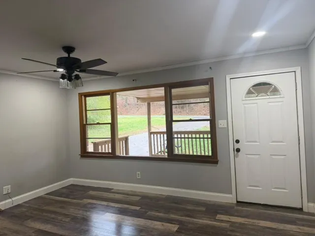 Wood-finish flooring, recessed lighting, and a ceiling fan with integrated lighting