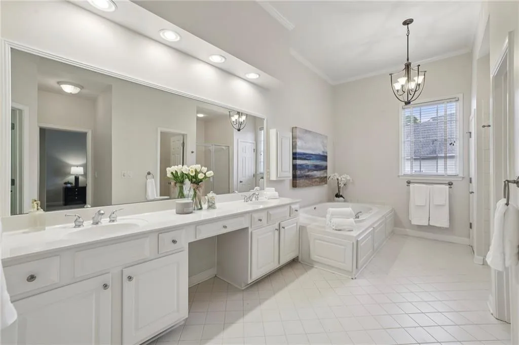 Loads of space and storage in this gracious primary bath