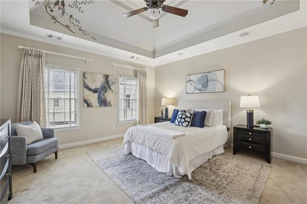 Primary bedroom with tray ceiling