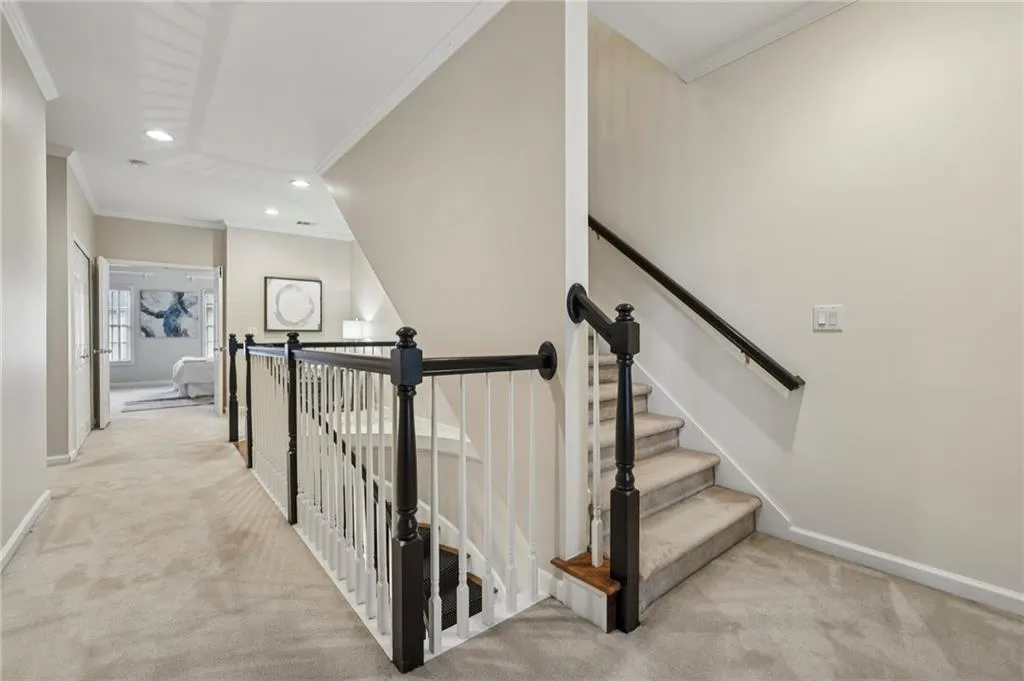 Second floor hallway and stairs to the top level