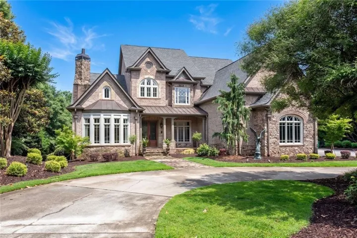 Stately home featuring a brick & stone facade!