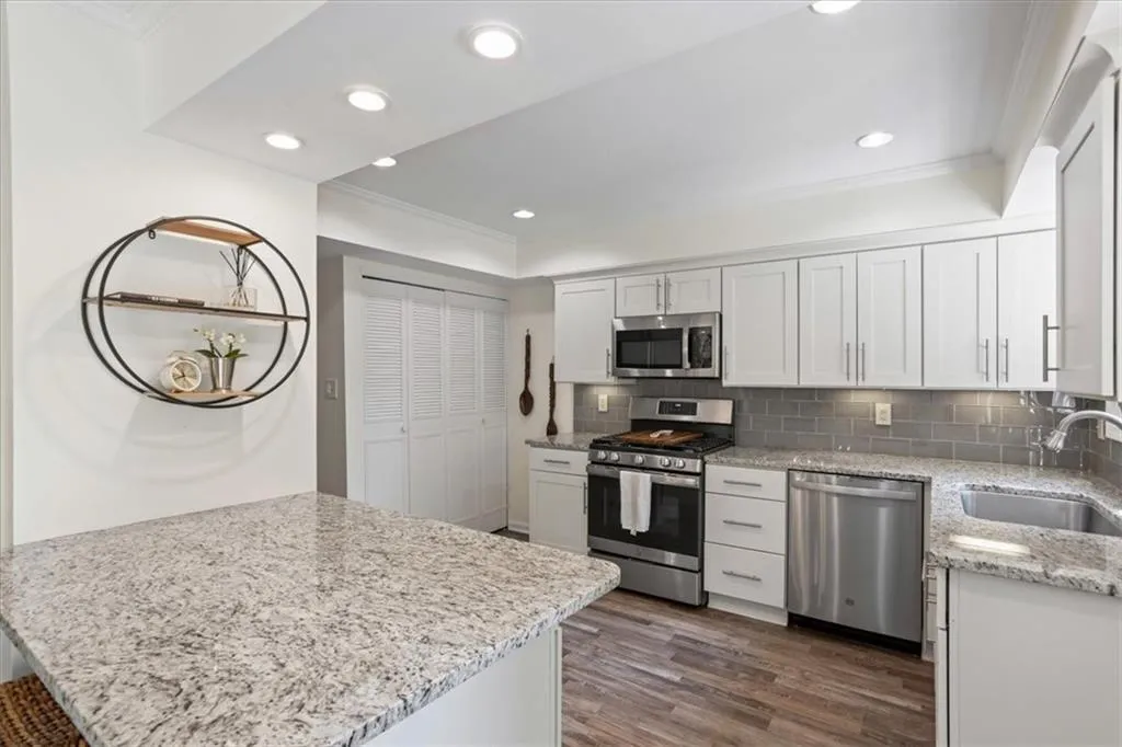 laundry and storage behind cabinets