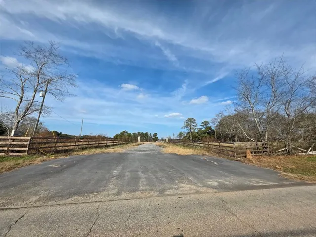 View of asphalt road featuring a view of countryside