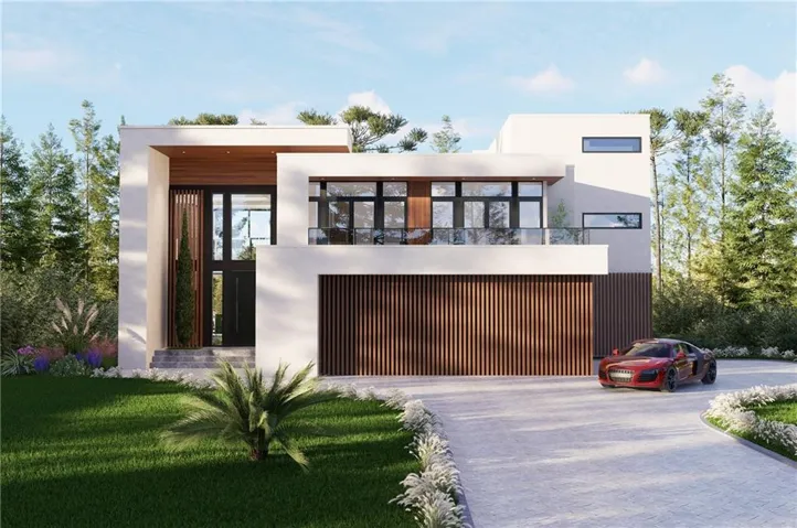 Contemporary house featuring stucco siding, decorative driveway, and a front yard