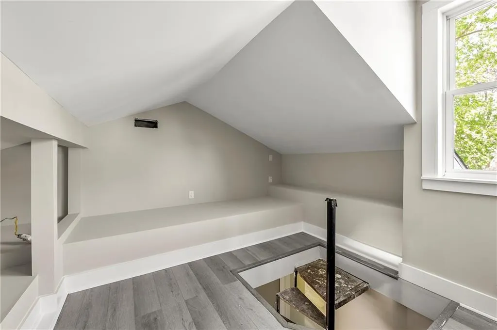 Attic area finished with fresh paint and luxury plank tile floor