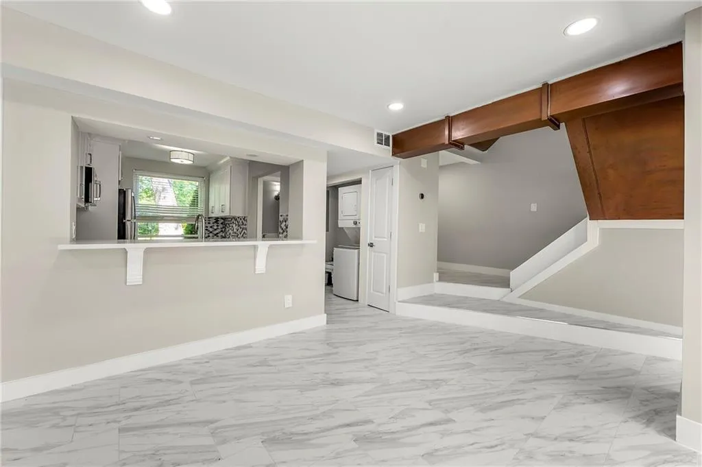 living room with tile  finish floor, recessed lighting