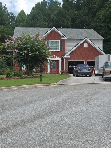 Brick and siding exterior with a gabled roof