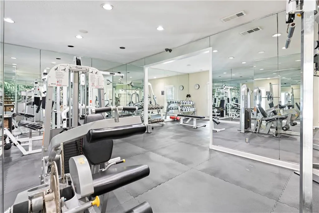 Exercise room featuring recessed lighting