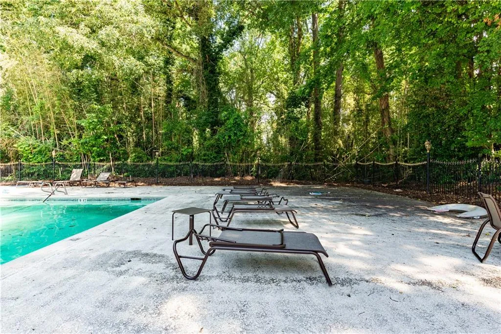 Community pool featuring a patio
